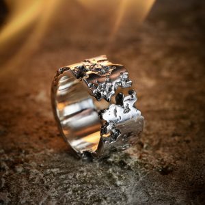 Photo with chunky crack silver ring in fire.